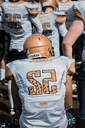 american football group of American football player helmet
